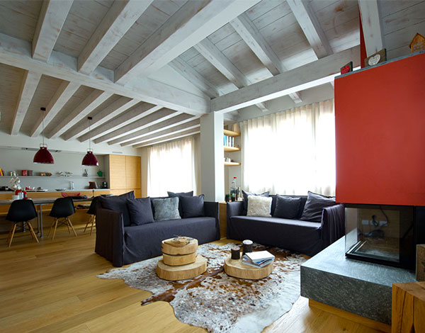A warm and welcoming home with red and natural wood